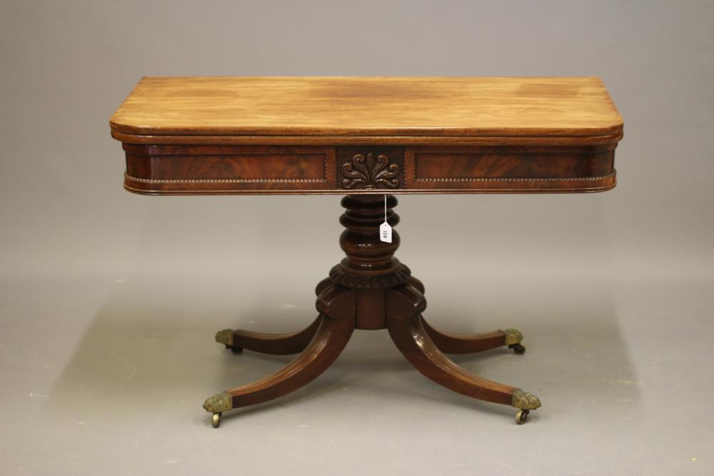 A REGENCY MAHOGANY FOLDING BREAKFAST TABLE Image