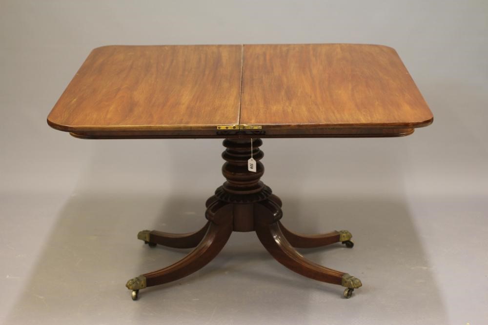 A REGENCY MAHOGANY FOLDING BREAKFAST TABLE Image