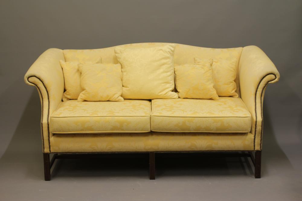 A GEORGIAN STYLE HUMP BACKED SOFA Image