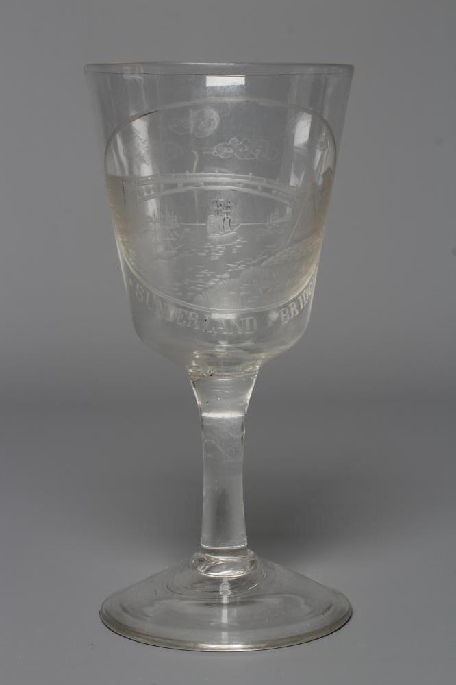 A SUNDERLAND BRIDGE CLEAR GLASS GOBLET, the bucket bowl wheel engraved with a titled oval panel, Image