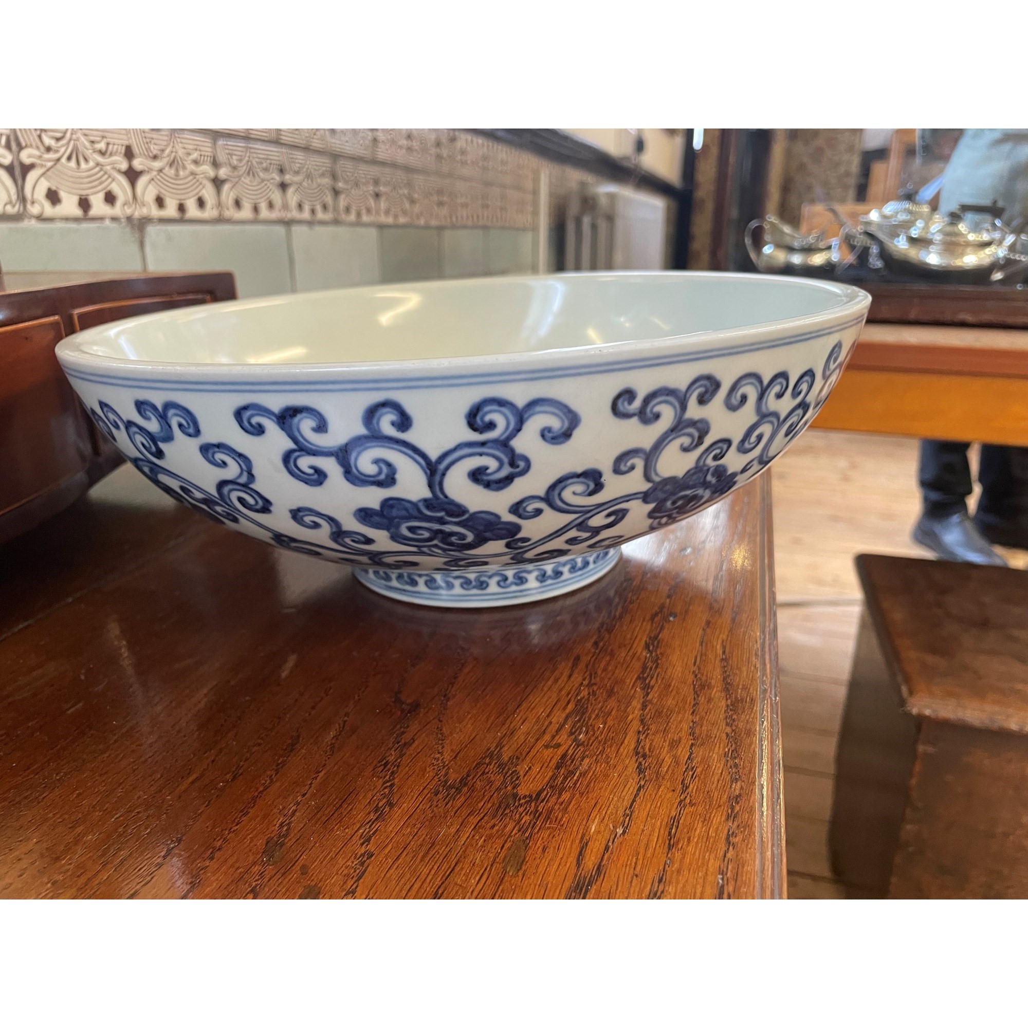 A CHINESE PORCELAIN SHALLOW BOWL of plain circular form, the exterior painted in underglaze blue Image