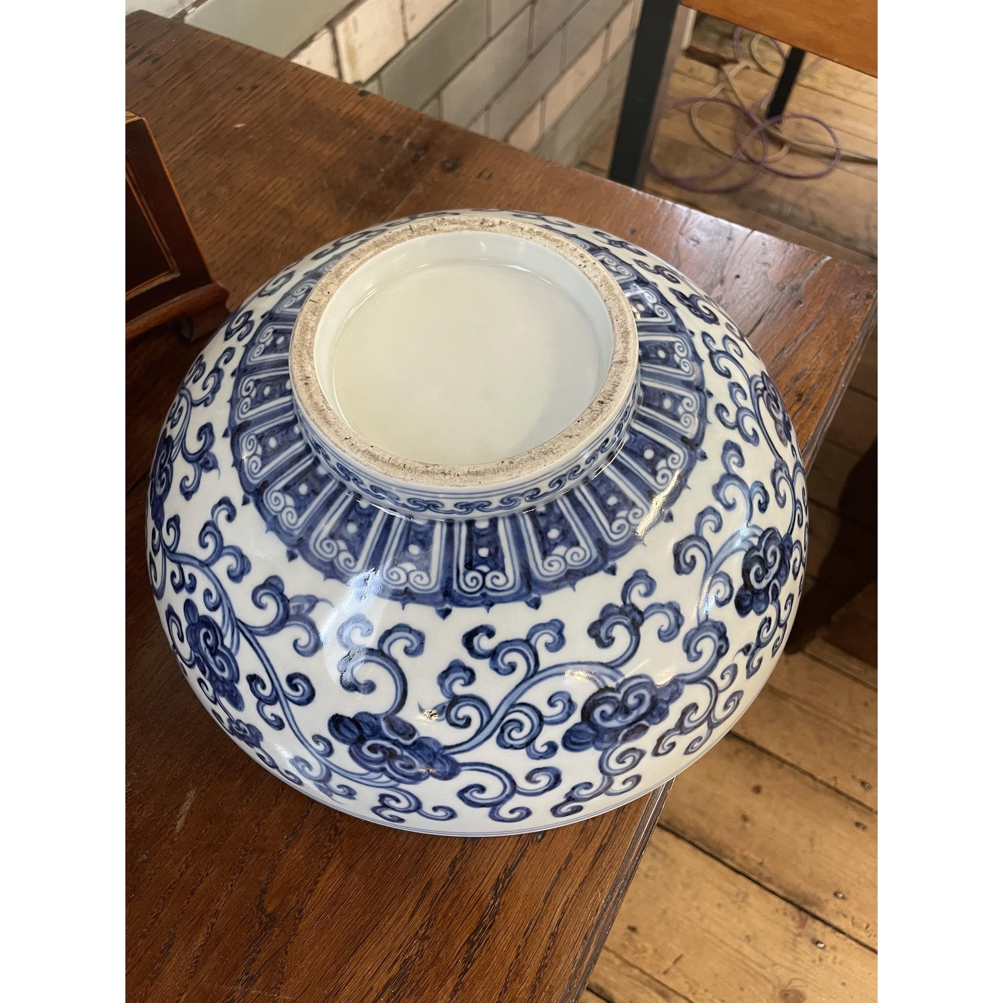 A CHINESE PORCELAIN SHALLOW BOWL of plain circular form, the exterior painted in underglaze blue Image