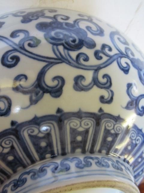 A CHINESE PORCELAIN SHALLOW BOWL of plain circular form, the exterior painted in underglaze blue Image