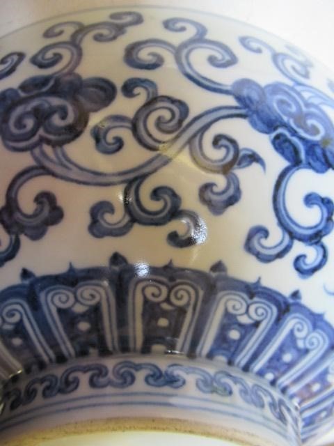 A CHINESE PORCELAIN SHALLOW BOWL of plain circular form, the exterior painted in underglaze blue Image