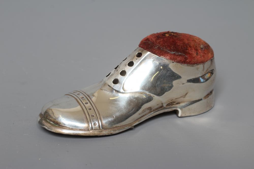 A NOVELTY SILVER PIN CUSHION by S. Blankensee & Co., Birmingham 1918, modelled as a gentleman's Image