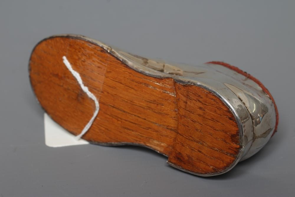 A NOVELTY SILVER PIN CUSHION by S. Blankensee & Co., Birmingham 1918, modelled as a gentleman's Image