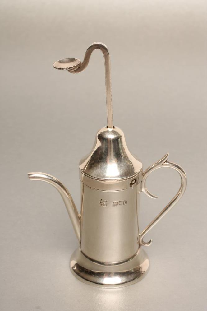 A SILVER NOVELTY SCENT DISPENSER Image