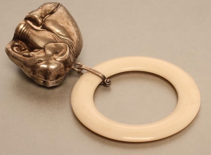 A SILVER NOVELTY RATTLE Image