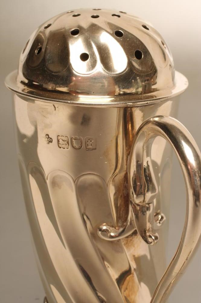 A LATE VICTORIAN SILVER NOVELTY SUGAR CASTOR Image