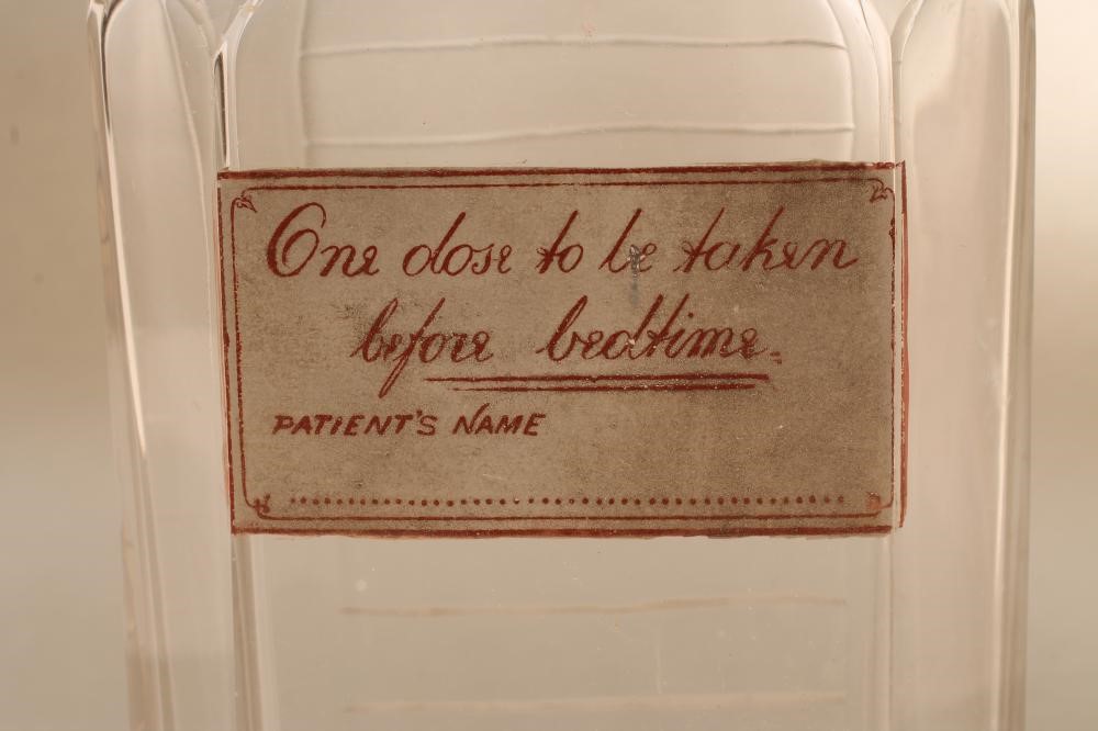 A LATE VICTORIAN SILVER MOUNTED GLASS NOVELTY SPIRIT DECANTER Image