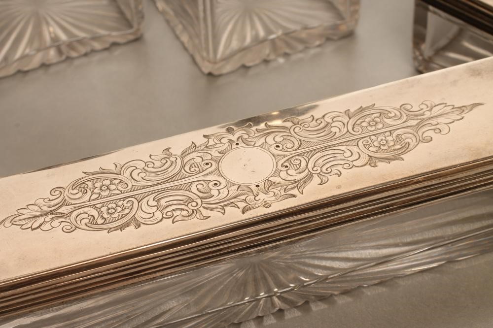 AN EARLY VICTORIAN SILVER TRAVELLING DRESSING SET Image