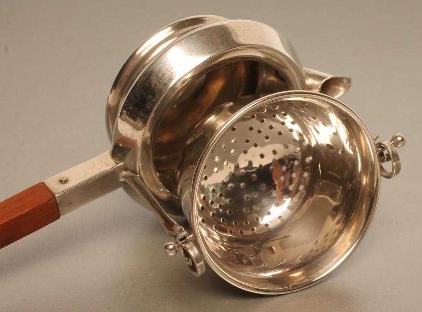 AN EDWARDIAN SILVER TEA STRAINER Image