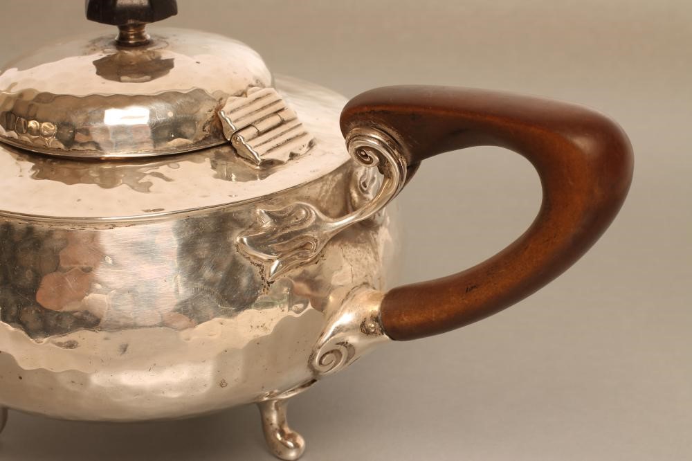 AN ARTS AND CRAFTS SILVER TEAPOT Image