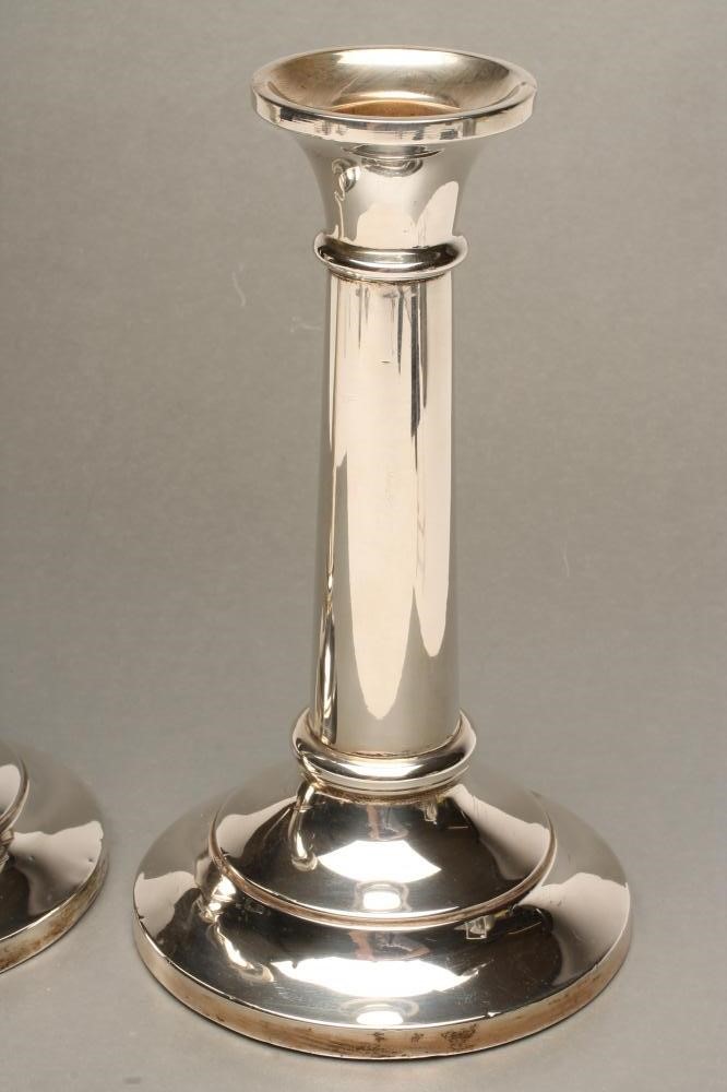 A PAIR OF SILVER CANDLESTICKS Image
