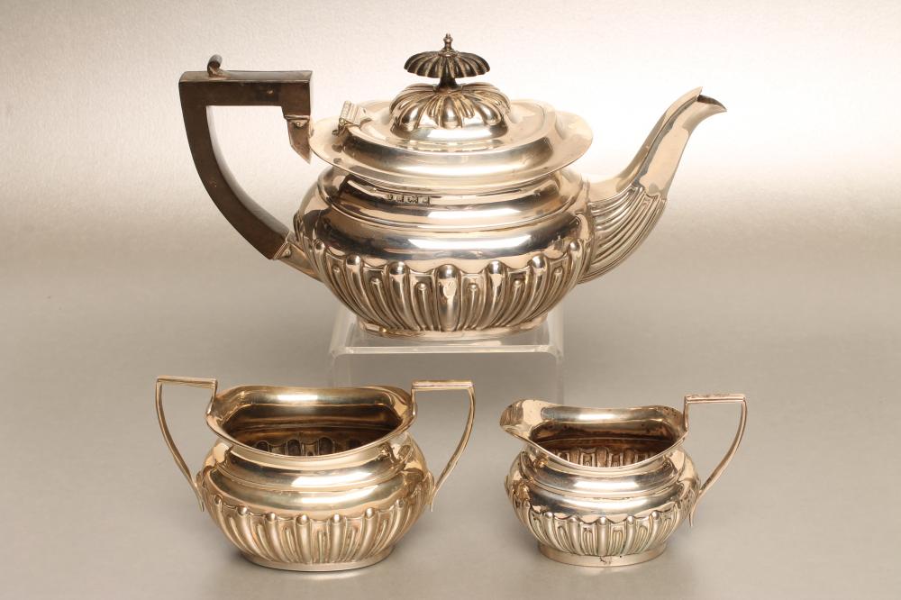 AN EDWARDIAN BACHELOR'S SILVER THREE PIECE TEA SERVICE Image
