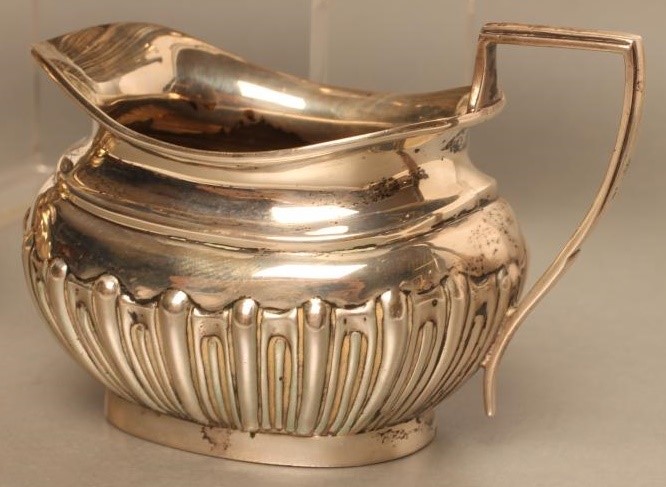 AN EDWARDIAN BACHELOR'S SILVER THREE PIECE TEA SERVICE Image