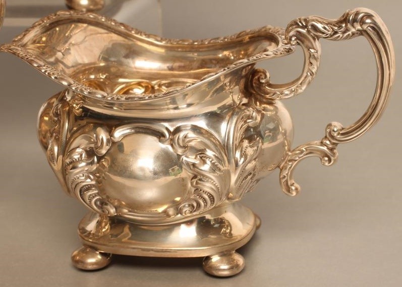 A LATE VICTORIAN SILVER THREE PIECE TEA SERVICE Image