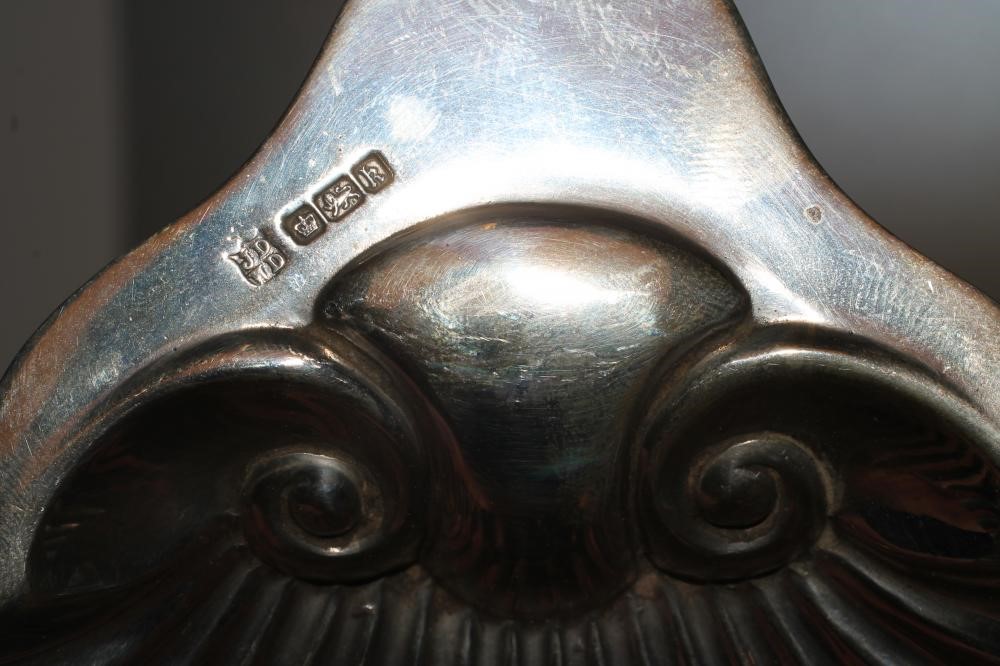 AN EDWARDIAN SILVER BUTTER SHELL Image