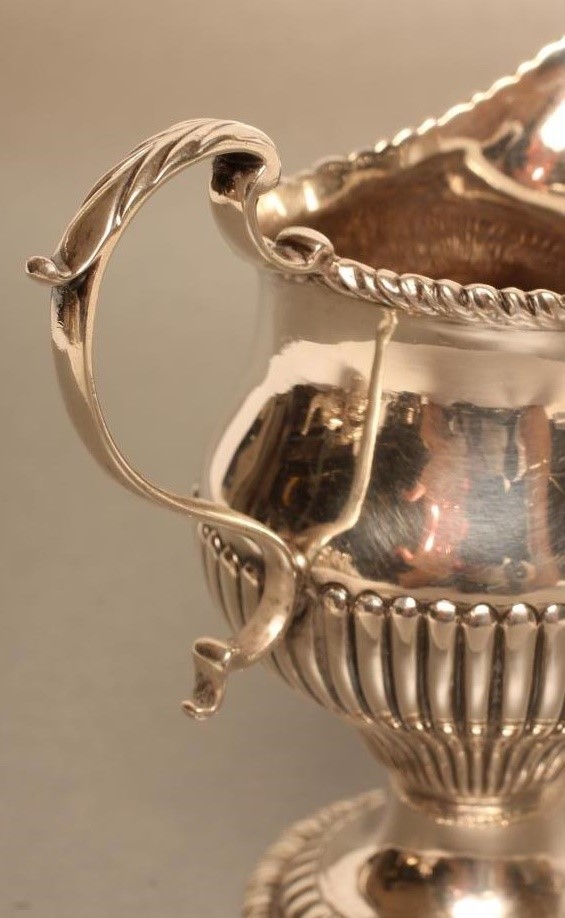 A GEORGE III SILVER MILK JUG Image