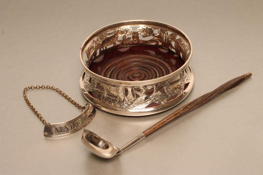 AN EDWARDIAN IRISH SILVER BOTTLE COASTER Image