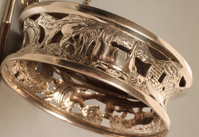 AN EDWARDIAN IRISH SILVER BOTTLE COASTER Image