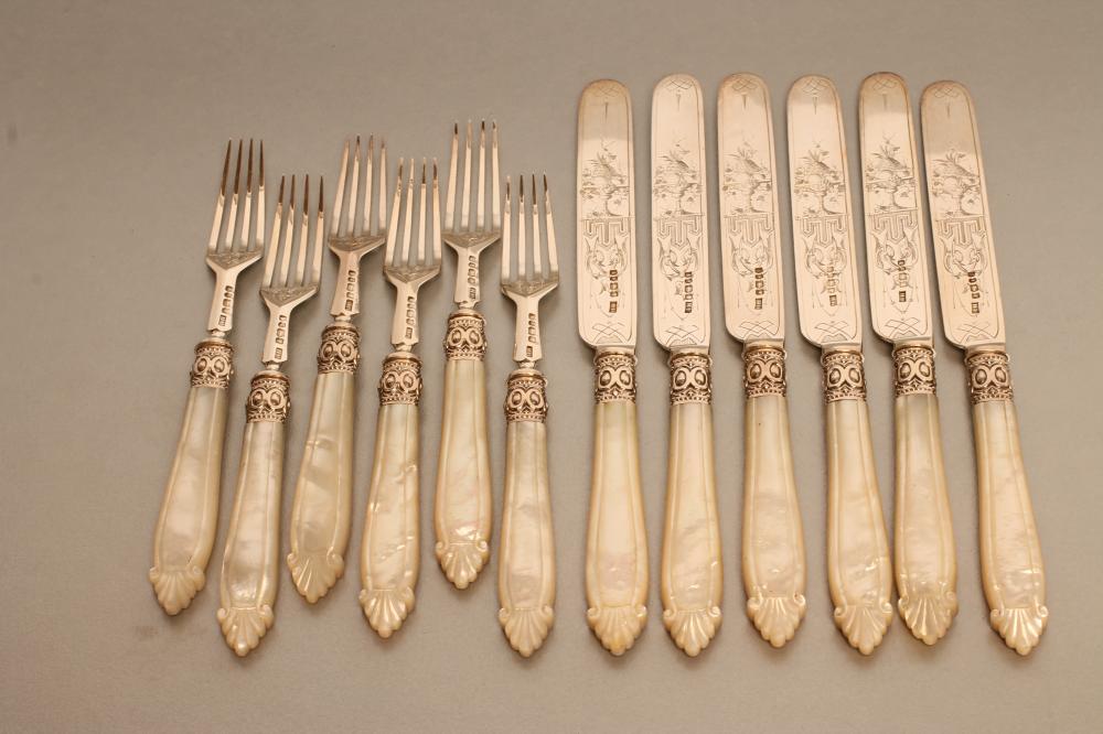 A SET OF SIX PAIRS OF VICTORIAN SILVER DESSERT KNIVES AND FORKS Image