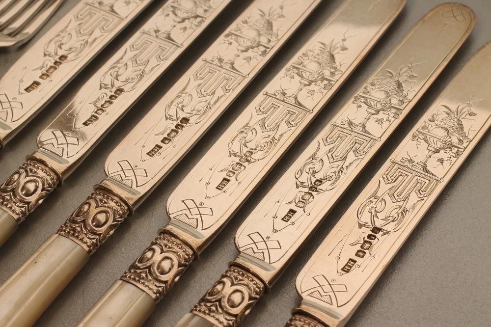 A SET OF SIX PAIRS OF VICTORIAN SILVER DESSERT KNIVES AND FORKS Image