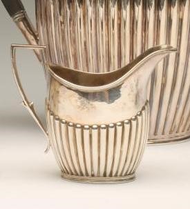 A LATE VICTORIAN SILVER COMPOSITE THREE PIECE TEA SERVICE Image