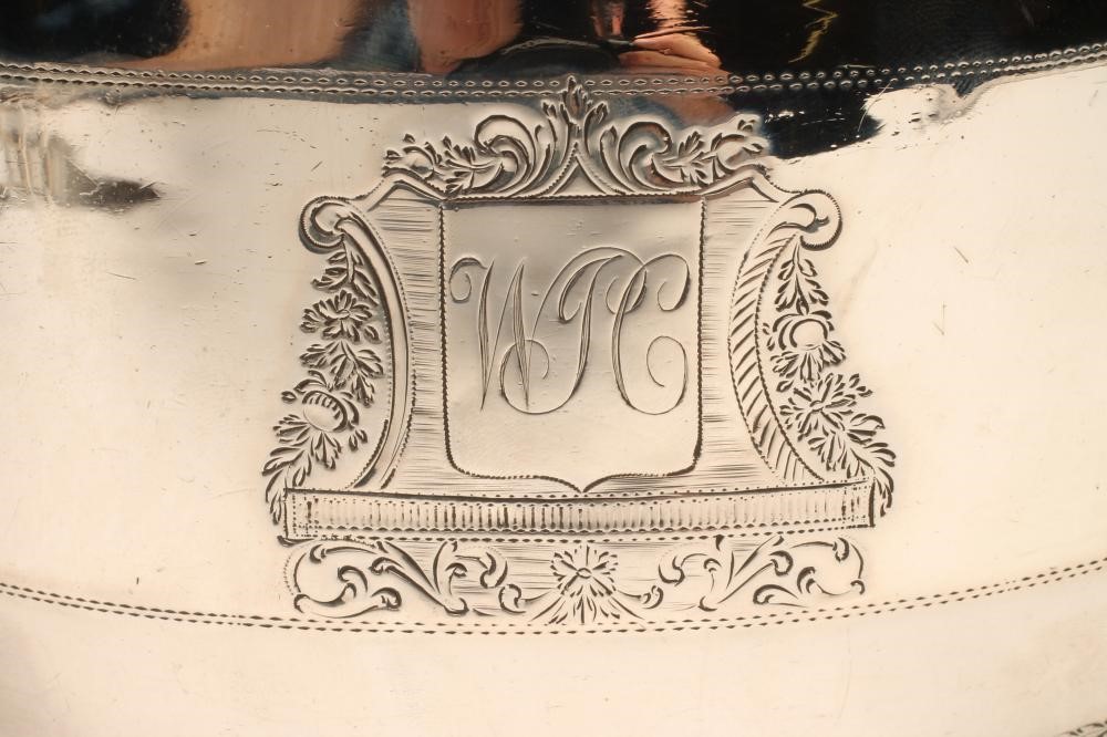 A LATE GEORGE III SILVER TEAPOT Image