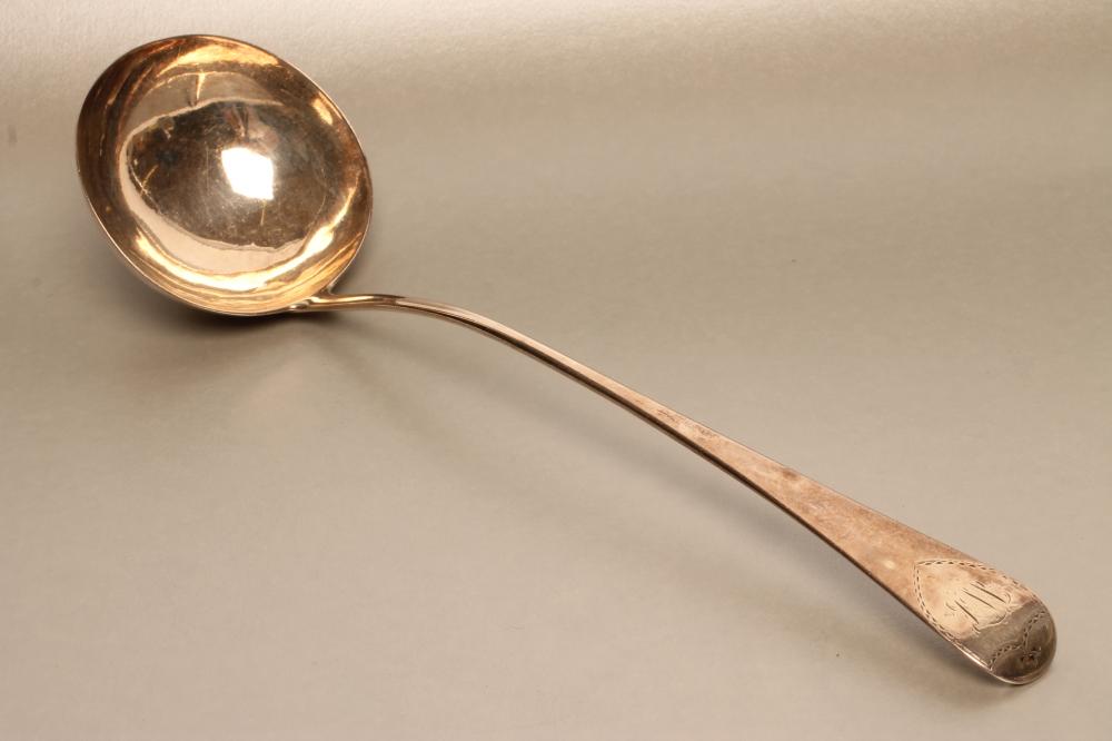 A LATE GEORGE III SILVER SOUP LADLE Image