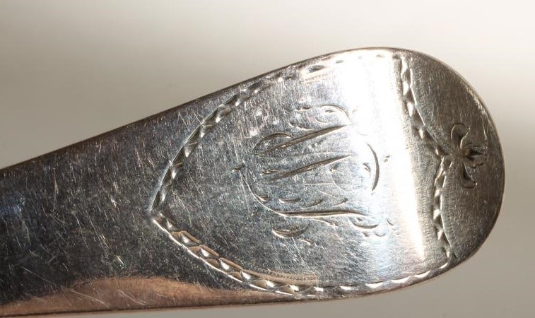 A LATE GEORGE III SILVER SOUP LADLE Image