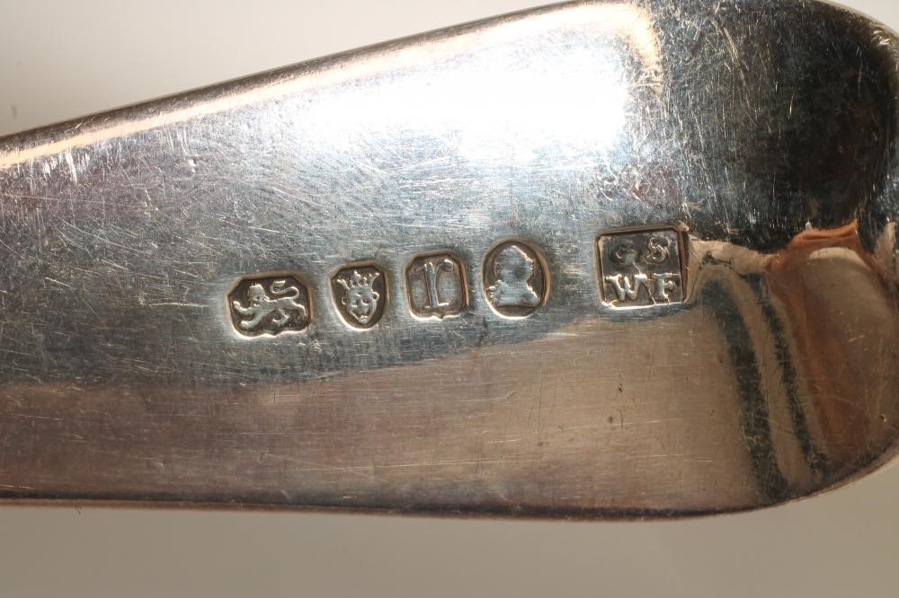 A LATE GEORGE III SILVER SOUP LADLE Image