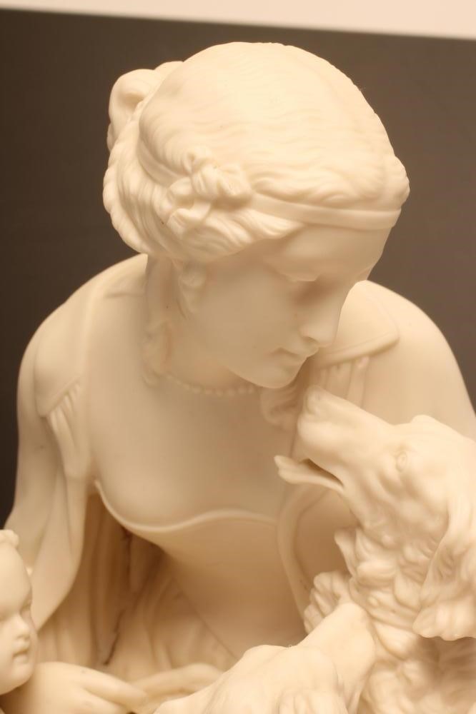 A VICTORIAN PARIAN FIGURE GROUP modelled as a young lady seated on a tree stump Image