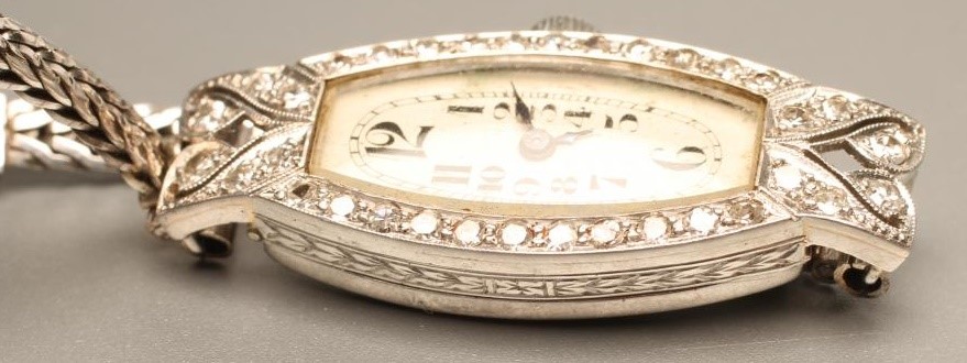 AN ART DECO DIAMOND AND PLATINUM CASED COCKTAIL WATCH Image