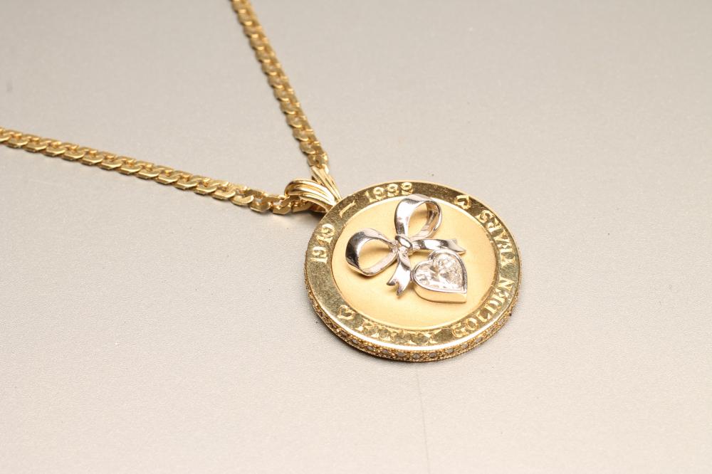 A DIAMOND SET BI-COLOUR 18CT GOLD PENDANT of plain circular form Image