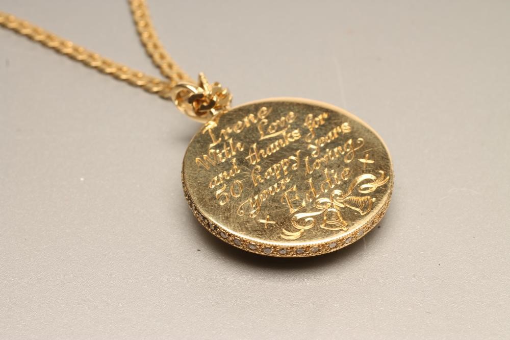 A DIAMOND SET BI-COLOUR 18CT GOLD PENDANT of plain circular form Image