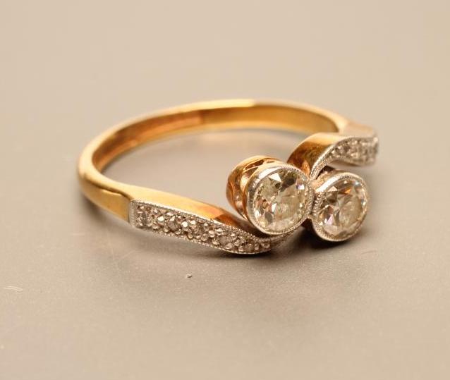 A TWO STONE DIAMOND CROSSOVER RING Image
