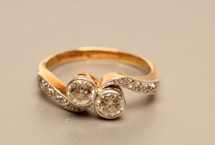 A TWO STONE DIAMOND CROSSOVER RING Image