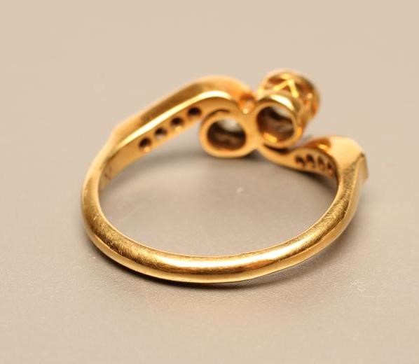 A TWO STONE DIAMOND CROSSOVER RING Image