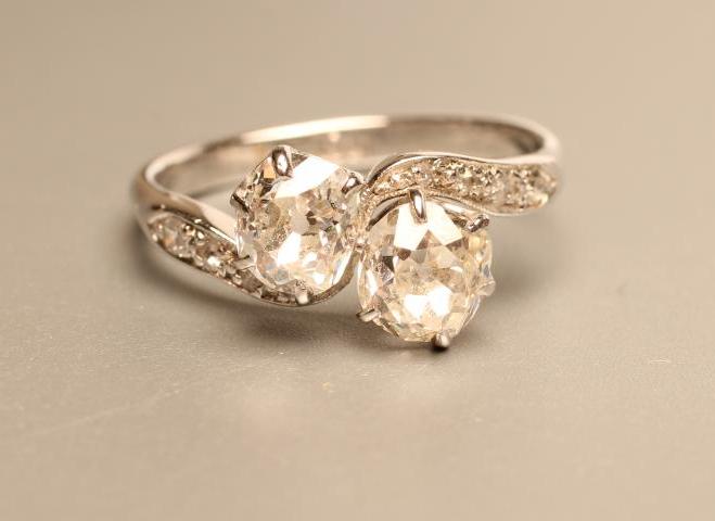 A TWO STONE DIAMOND CROSSOVER RING Image