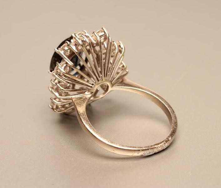 A SAPPHIRE AND DIAMOND CLUSTER RING Image