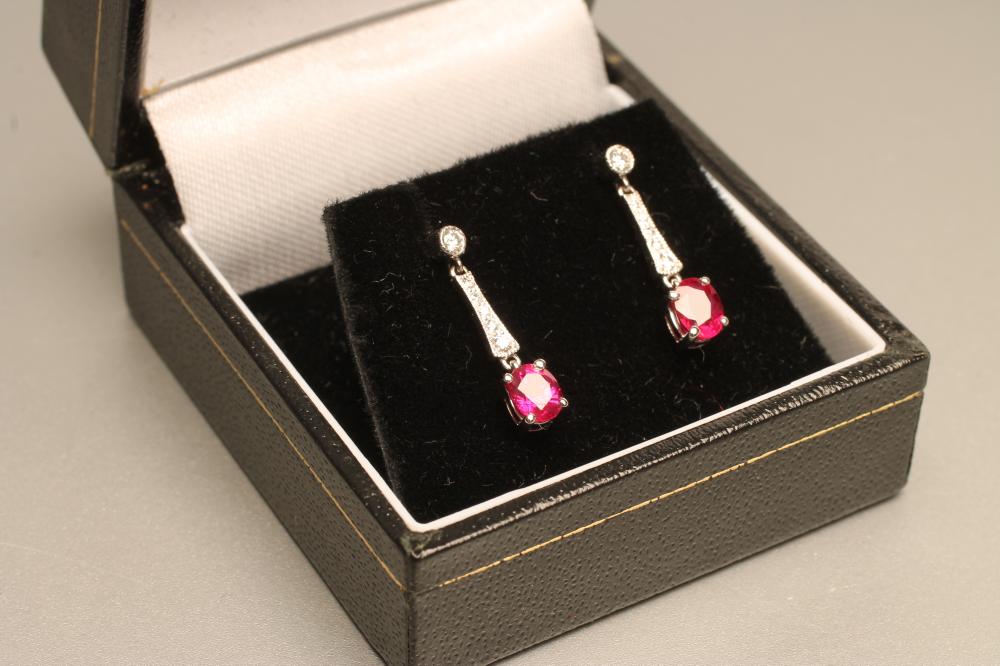 A PAIR OF RUBY AND DIAMOND DROP EAR STUDS Image