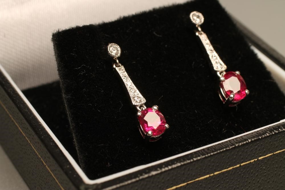 A PAIR OF RUBY AND DIAMOND DROP EAR STUDS Image
