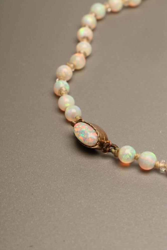 A PAIR OF OPAL AND DIAMOND EAR STUDS Image