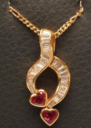 A DIAMOND AND RUBY PENDANT of open abstract form Image