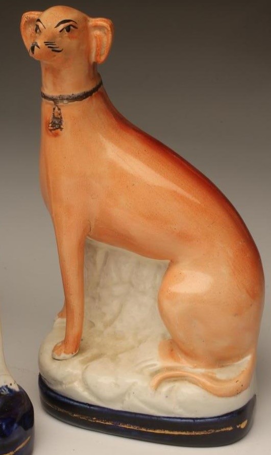 A PAIR OF VICTORIAN STAFFORDSHIRE POTTERY GREYHOUNDS Image