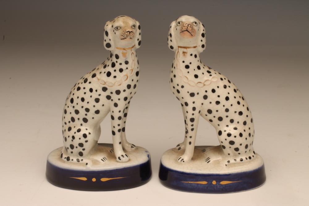 A PAIR OF LATE VICTORIAN STAFFORDSHIRE POTTERY DALMATIONS Image