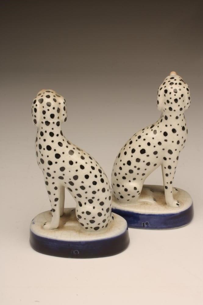 A PAIR OF LATE VICTORIAN STAFFORDSHIRE POTTERY DALMATIONS Image