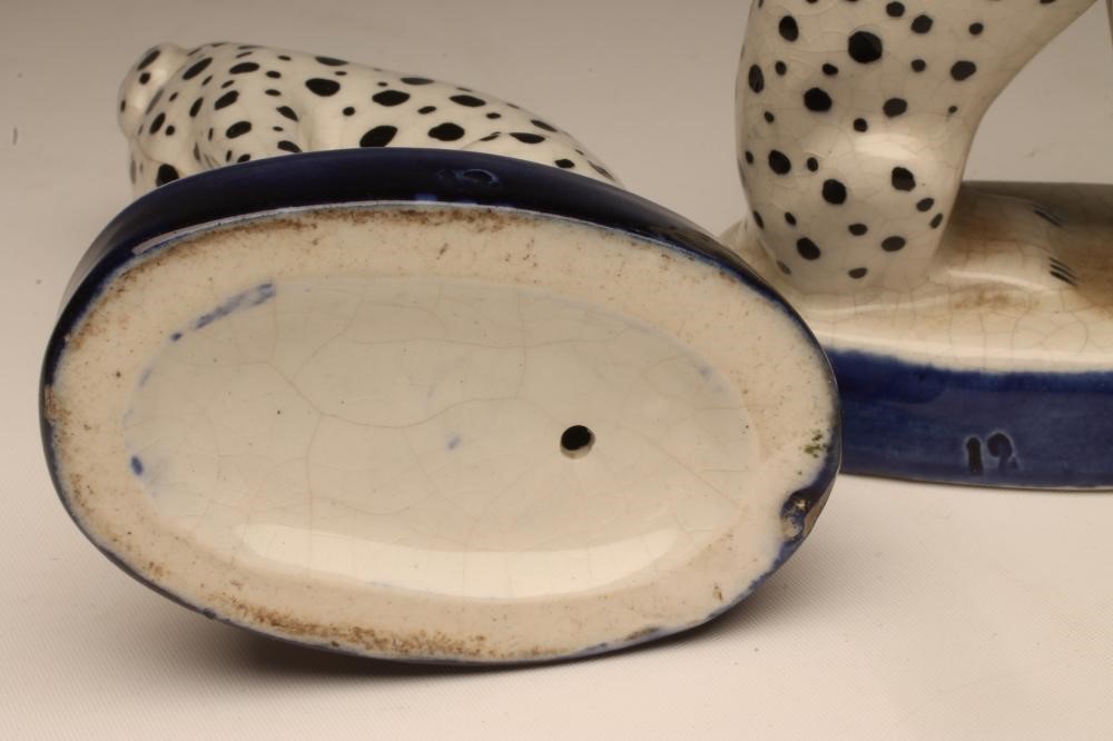 A PAIR OF LATE VICTORIAN STAFFORDSHIRE POTTERY DALMATIONS Image