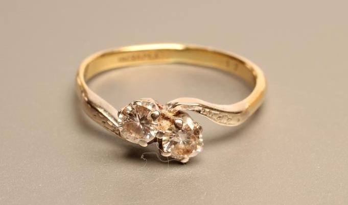 A TWO STONE DIAMOND CROSSOVER RING Image